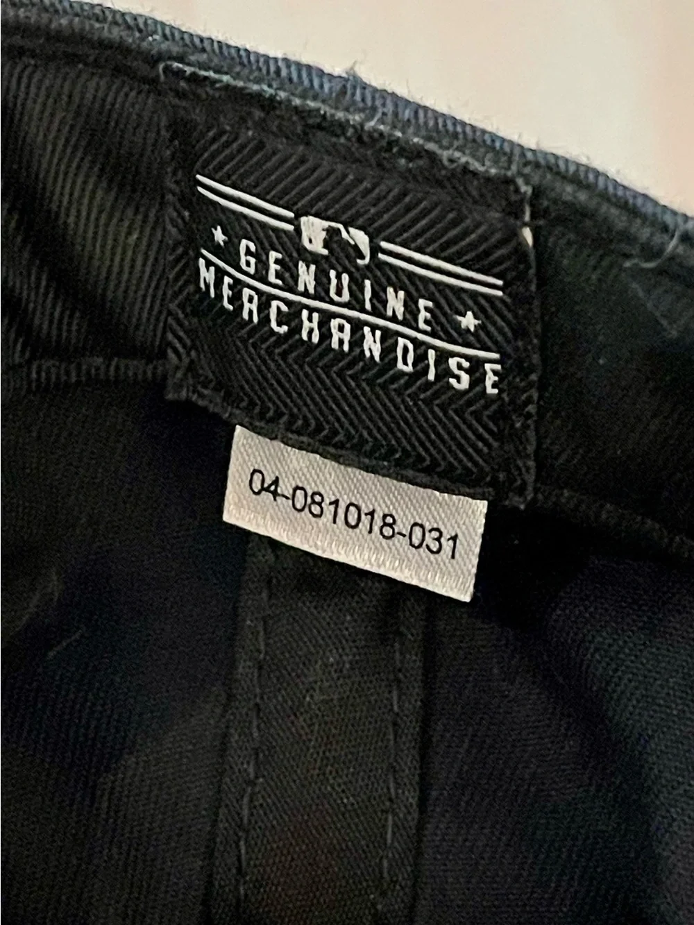 Genuine Merchandise Black Cap with White Logo Tag